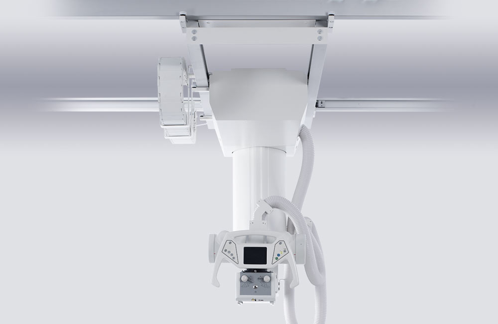 Ceilingmounted Xray system with patient positioning table and wall stand
