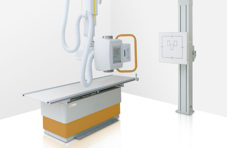 Ceiling-mounted X-ray machine with adjustable patient table and wall stand